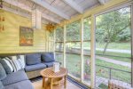 Relax on the porch of Sunshine Cottage as you watch the world go by